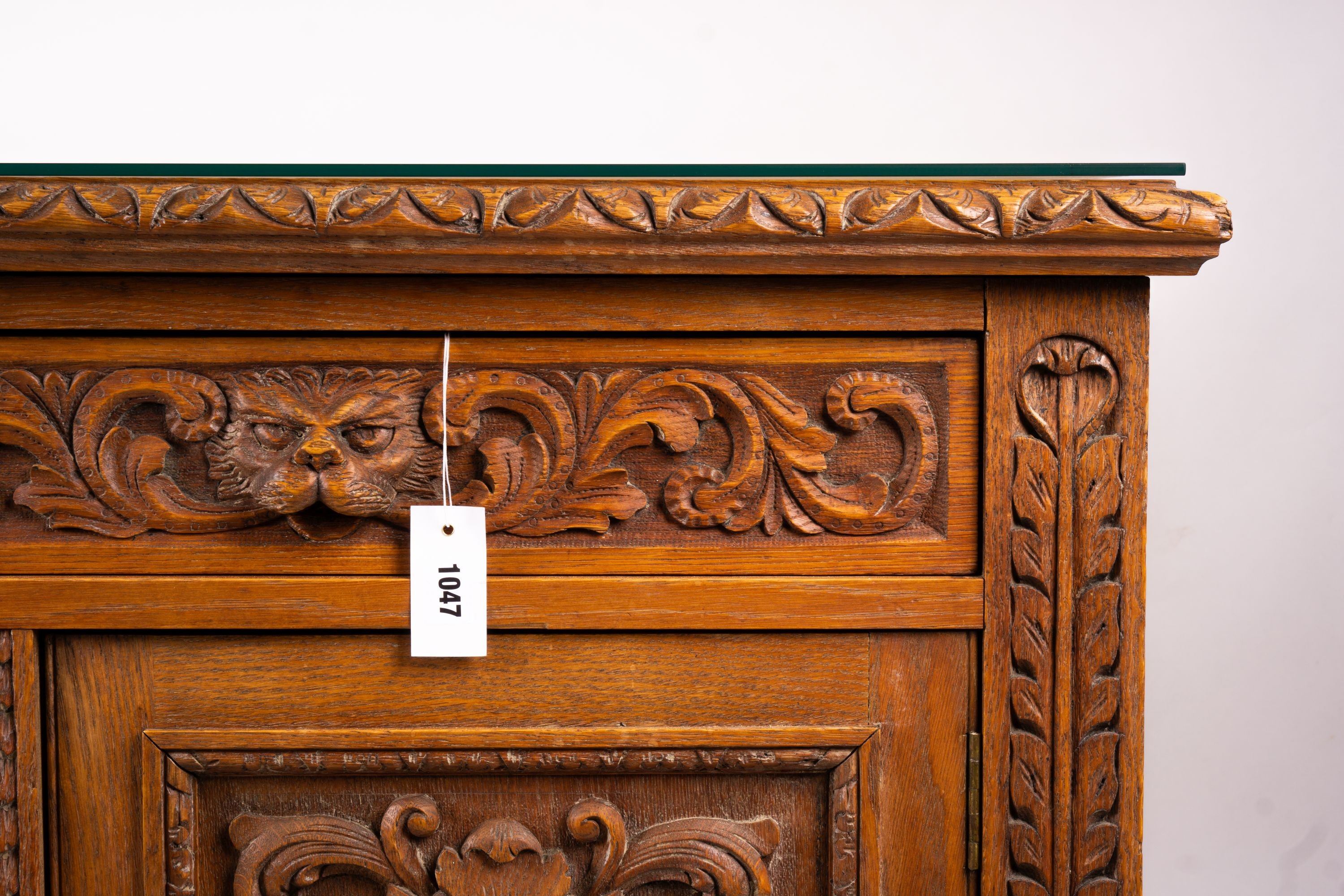 A late 19th century Flemish carved oak buffet, length 158cm, depth 58cm, height 99cm